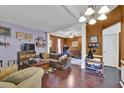 Cozy living room featuring hardwood floors, a ceiling fan, and an open layout at 1003 Dunedin Trl, Woodstock, GA 30188
