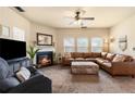Inviting living room with a fireplace, plush seating, and ample natural light at 106 Cessna Dr, Canton, GA 30114
