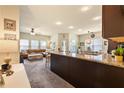 Open concept living space features a large leather sectional, granite countertop and a dining area at 106 Cessna Dr, Canton, GA 30114