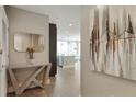 Hallway boasts modern decor, light hardwood floors, and a glimpse of the open kitchen at 1080 Peachtree Ne St # 1402, Atlanta, GA 30309