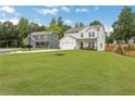 Beautiful home featuring a well-manicured lawn and landscaping, complementing the house's inviting curb appeal at 16 Dovecrest Way, Acworth, GA 30101