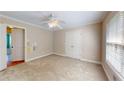 Clean bedroom with neutral walls, carpet flooring, a ceiling fan, and a closet with double doors at 259 Hwy 11, Social Circle, GA 30025