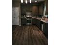 Functional kitchen showcasing stainless steel appliances and stylish tiled backsplash at 5580 Jamerson Dr, Atlanta, GA 30349