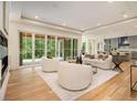 Spacious living room with sliding glass doors, and an open kitchen area, great for entertaining at 4757 Lake Forrest Drive Northwest Dr, Atlanta, GA 30342