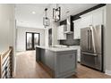 Modern kitchen boasts stainless appliances, a gray island, and chic lighting at 2333 Mason Dr # D26, Atlanta, GA 30316