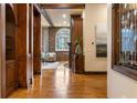 Elegant living room featuring hardwood floors, exposed brick, and a decorative fireplace at 3180 Mathieson Ne Dr # 1401, Atlanta, GA 30305