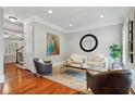Cozy living room with hardwood floors, natural light, designer furnishings, and artwork at 1070 Standard Ne Dr, Brookhaven, GA 30319