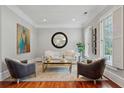 Bright living room with hardwood floors, natural light, designer furnishings, and neutral paint at 1070 Standard Ne Dr, Brookhaven, GA 30319