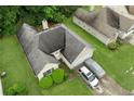 Aerial view showcasing a single-Gathering home with a well-manicured lawn in a residential neighborhood at 1394 Isleworth Cir, Atlanta, GA 30349