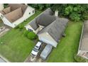 Overhead shot of a cozy single-Gathering home in a suburban setting with green lawns at 1394 Isleworth Cir, Atlanta, GA 30349