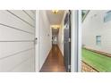 Inviting entryway hallway with dark hardwood floors, neutral walls, and modern lighting at 147 Townview Dr, Woodstock, GA 30189