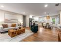 Open-concept living room and kitchen with modern appliances, stylish decor, and hardwood floors at 1927 Alexander Se St, Smyrna, GA 30080