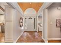 Elegant entryway featuring brick flooring, custom ceiling design and natural light at 7265 Hunters Branch Dr, Sandy Springs, GA 30328