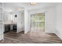 Bright kitchen featuring stainless steel appliances, white cabinets, and sliding door access at 3232 Abbeywood Dr, Decatur, GA 30034