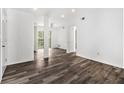 Spacious living room with modern floors, fresh white paint, and lots of natural light at 3232 Abbeywood Dr, Decatur, GA 30034