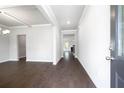 Inviting entryway featuring hardwood floors and an open floor plan at 113 Canal St, Hampton, GA 30228