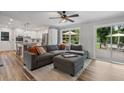 Comfortable living room with hardwood floors, large windows, and access to the outdoor deck at 2109 Allgood Rd, Marietta, GA 30062