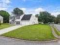 Corner lot home with a two-car garage and well maintained lawn at 2833 Golden Club Bnd, Austell, GA 30106