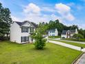 View of a two-story home from the side, with a well-maintained lawn at 2833 Golden Club Bnd, Austell, GA 30106