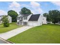 Traditional two-story home on a well maintained large lawn and long driveway at 2833 Golden Club Bnd, Austell, GA 30106