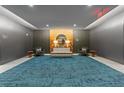 Relaxing lobby area with elegant seating, a round mirror, and ambient lighting at 775 Juniper Ne St # 210, Atlanta, GA 30308