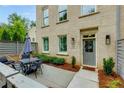 Inviting front patio showcasing modern outdoor seating and a stylish entrance to the home at 302 Boxwood Ln, Roswell, GA 30075