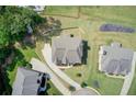Aerial view of home showcasing landscaping, large lot, driveway, and neighborhood at 332 Warwick Pl, Mcdonough, GA 30253