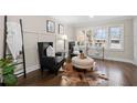 Cozy sitting area with elegant chairs, an ottoman, and beautiful hardwood floors at 2151 Zelda Ne Dr, Atlanta, GA 30345
