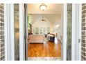 Elegant living room showcasing hardwood floors, high ceilings, and an abundance of natural light at 815 Spring View Ct, Covington, GA 30014