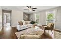 Comfortable living room with hardwood floors, shiplap accent walls, and a bright, airy atmosphere at 385 Russell Ridge Dr, Lawrenceville, GA 30043