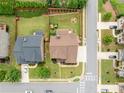 Aerial view of property highlighting manicured lawn, fenced yard and mature trees at 4015 Roberts Crest Ln, Suwanee, GA 30024