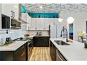 Well-equipped kitchen with sleek countertops, black lower cabinets, and stainless steel appliances at 112 Rogers Street Ne # 505, Atlanta, GA 30317