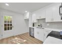 Bright, updated kitchen with white cabinets, stainless appliances, and a door to the outside at 1 N Boundary Nw Pl, Atlanta, GA 30318