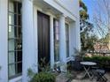 Inviting front entrance with a dark-wood door framed by white pillars and lush landscaping at 2067 Telfair Circle # A&B, Atlanta, GA 30324