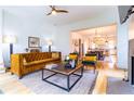 Bright and airy living room with modern decor, wood floors, and an open concept design leading to the kitchen at 2067 Telfair Circle # A&B, Atlanta, GA 30324