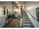 Inviting foyer with staircase, showcasing neutral tones and decorative accents at 125 Rue Fontaine, Lithonia, GA 30038