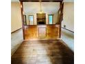 Open living room with hardwood floors and stone fireplace at 1905 Sidneys Cv, Lawrenceville, GA 30043