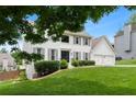 Charming white two-story home with a manicured lawn, garage, and tasteful landscaping at 3710 Robinson Walk Ct, Marietta, GA 30068