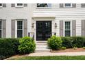 Inviting front entrance featuring a double door, manicured bushes, and stone steps at 3710 Robinson Walk Ct, Marietta, GA 30068