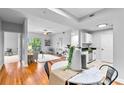 Open-concept layout showcasing the living room with a balcony and the adjacent kitchen and dining area at 1075 Peachtree Walk # A-307, Atlanta, GA 30309