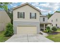 Charming two-story house with a two-car garage, well-maintained lawn, and inviting curb appeal at 236 Arbor Creek Dr, Dallas, GA 30157