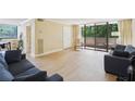 Bright living room with light floors and access to a private balcony at 3530 Piedmont Ne Rd # 2I, Atlanta, GA 30305