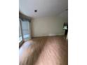 Bright living room with hardwood floors and large windows offering natural light at 425 Rockingham Ln, Woodstock, GA 30189
