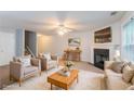 Staged living room showcasing fireplace, cozy furniture, and comfortable decor at 541 Shadow Valley Ct, Lithonia, GA 30058