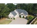 Beautiful home with manicured landscaping, inviting curb appeal at 255 Carriage Station Dr, Lawrenceville, GA 30046