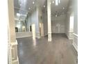 Bright, expansive living room with hardwood floors, high ceilings, and elegant wainscoting at 255 Carriage Station Dr, Lawrenceville, GA 30046