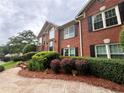 Inviting red brick home with well-maintained landscaping and a welcoming walkway at 208 Regency Ct, Acworth, GA 30102