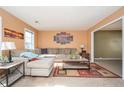 Cozy living room with comfortable seating, warm-toned walls, and ample natural light at 3090 Perch Sw Ln, Marietta, GA 30008