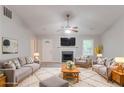 Bright living room with plush rug, fireplace, and neutral-toned furnishings at 5888 Old Wellborn Trce, Lithonia, GA 30058