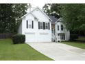 Charming two-story home featuring a two-car garage, well-maintained lawn, and beautiful exterior at 262 Devynwood Ln, Dallas, GA 30157